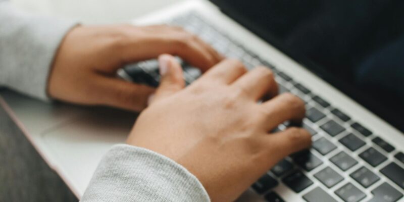 typing on laptop