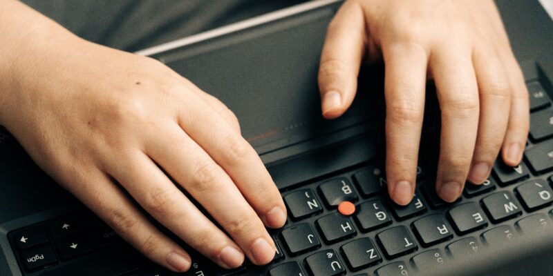 typing on laptop keyboard