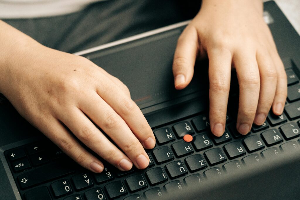typing on laptop keyboard