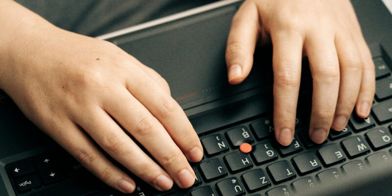 typing on laptop keyboard